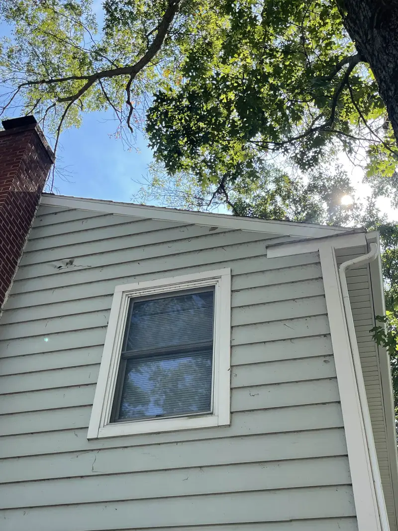 Gutter installation completed on a residential home, improving water management and preventing foundation damage.